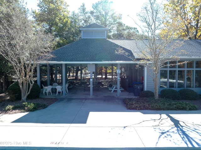 view of property's community featuring a patio and a gazebo