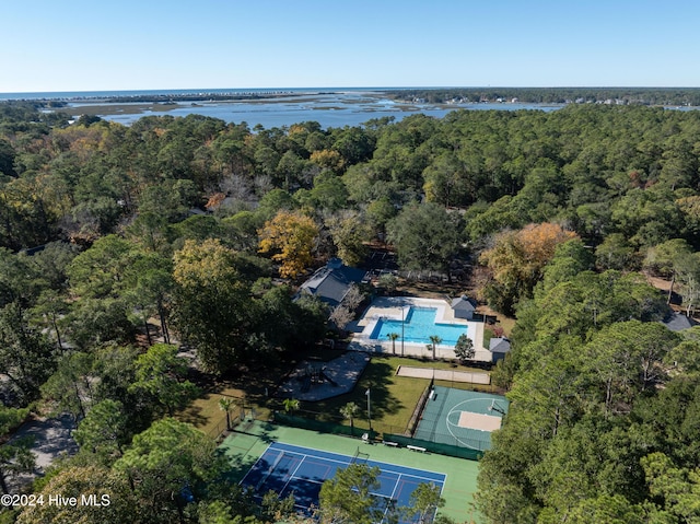 aerial view with a water view and a wooded view