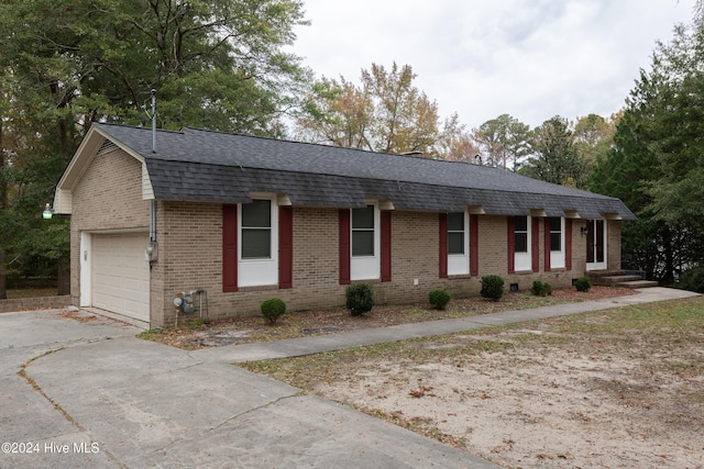 ranch-style house featuring a garage