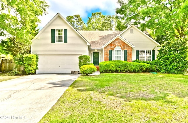 view of front facade with a garage and a front yard