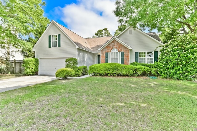 view of front facade with a garage and a front lawn