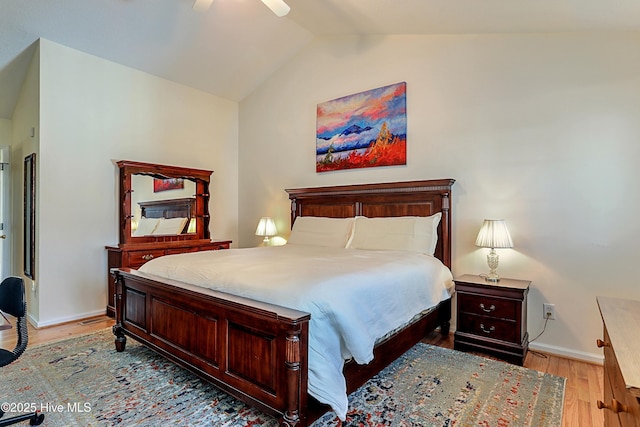 bedroom featuring vaulted ceiling, light hardwood / wood-style floors, and ceiling fan