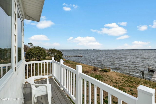 balcony featuring a water view