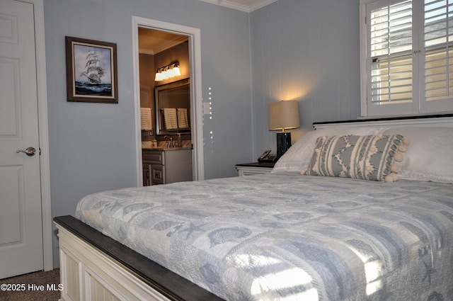 bedroom with ensuite bathroom, ornamental molding, and dark carpet