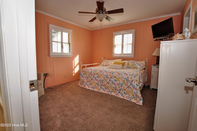 carpeted bedroom featuring crown molding, ceiling fan, and multiple windows