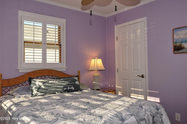 bedroom featuring ornamental molding and ceiling fan