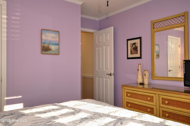 bedroom with crown molding