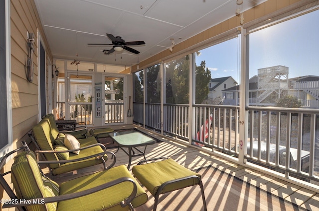 sunroom / solarium with ceiling fan