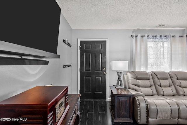 interior space with a textured ceiling