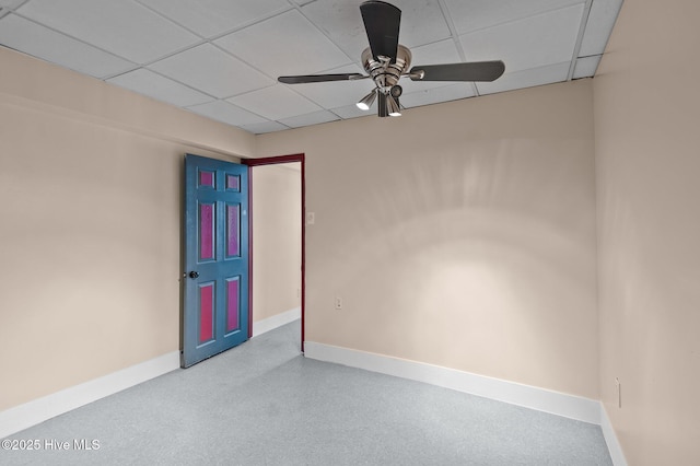 unfurnished room featuring ceiling fan and a drop ceiling