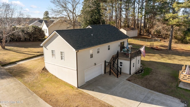 exterior space with a front yard and a garage