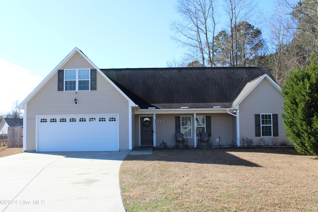 view of front facade with a garage and a front lawn