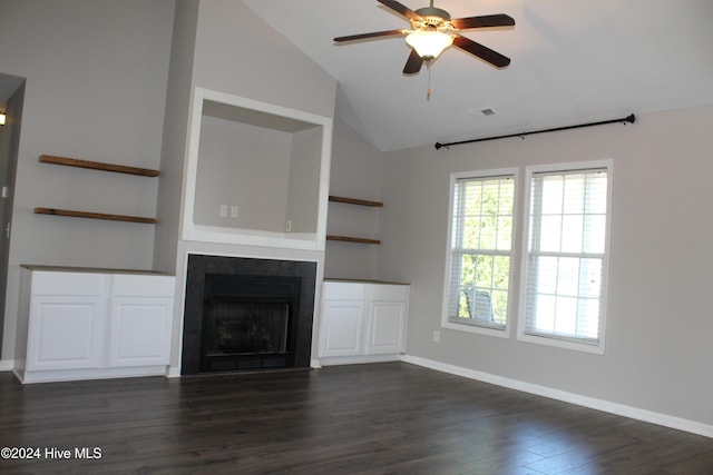 unfurnished living room featuring vaulted ceiling, ceiling fan, built in features, and dark hardwood / wood-style floors