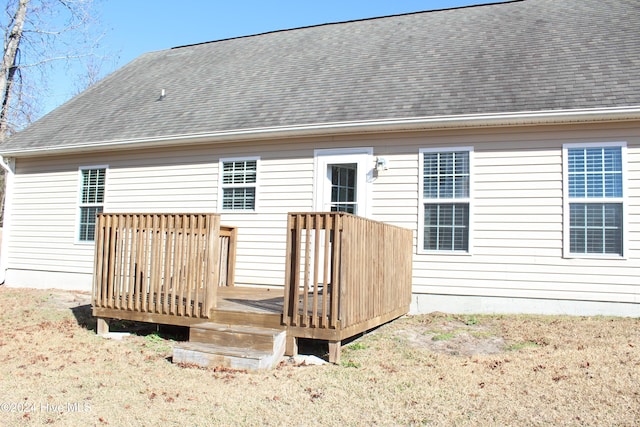 rear view of house with a wooden deck