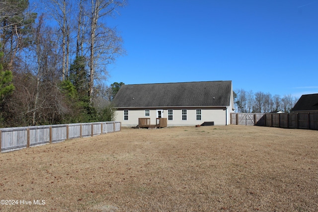 rear view of house with a lawn