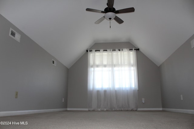 bonus room featuring ceiling fan, carpet floors, and vaulted ceiling