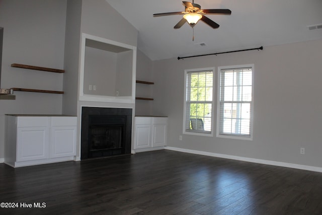 unfurnished living room featuring ceiling fan, dark hardwood / wood-style floors, built in features, and lofted ceiling