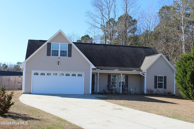 view of front facade with a garage and a front lawn