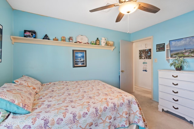 carpeted bedroom with ceiling fan