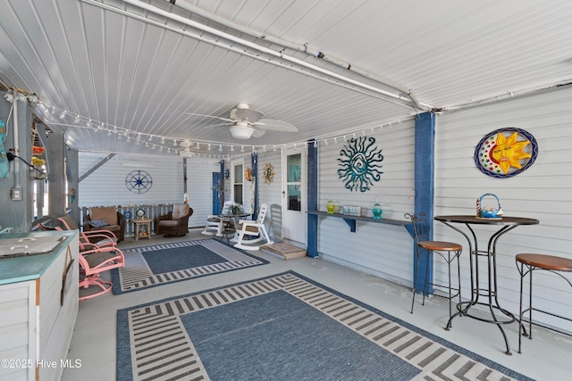 sunroom / solarium with ceiling fan