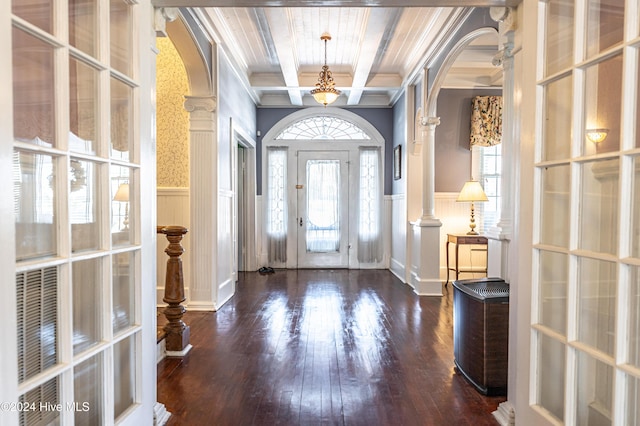 entrance foyer with beam ceiling, decorative columns, ornamental molding, and coffered ceiling