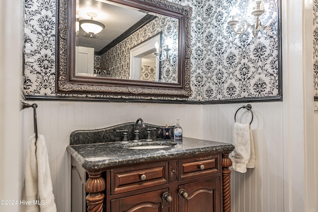 bathroom featuring vanity and crown molding