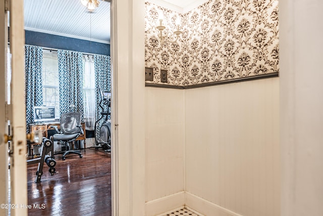 bathroom featuring wood-type flooring and ornamental molding