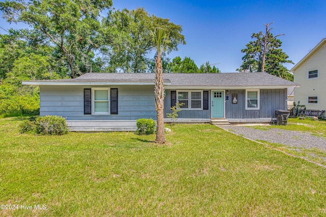 ranch-style house with a front lawn