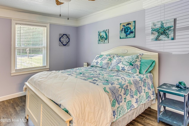 bedroom featuring ceiling fan, dark hardwood / wood-style flooring, and ornamental molding