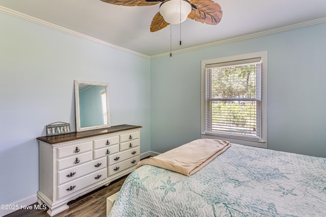 bedroom with ceiling fan, dark hardwood / wood-style floors, and ornamental molding