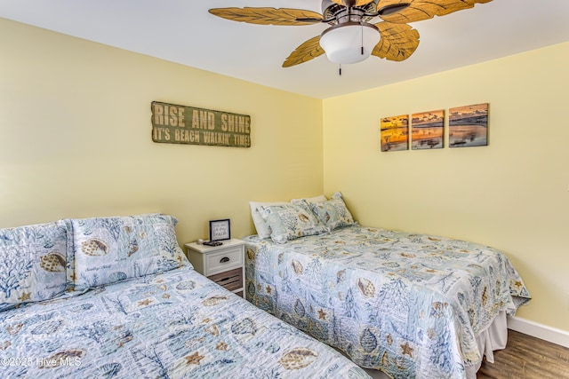 bedroom with ceiling fan and hardwood / wood-style floors