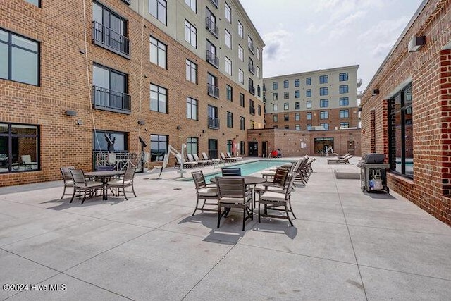 view of patio featuring a community pool