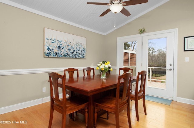 dining space featuring ceiling fan, light hardwood / wood-style flooring, and lofted ceiling