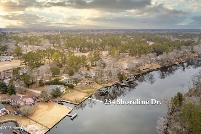 aerial view at dusk with a water view