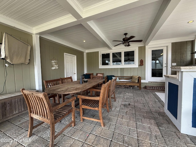 exterior space with ceiling fan