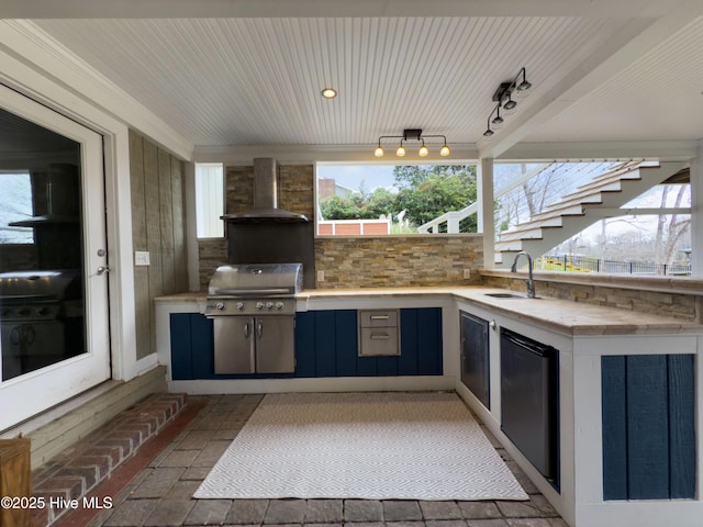 view of patio featuring exterior kitchen, grilling area, and sink