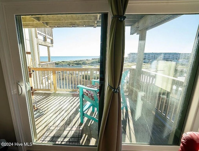 balcony featuring a water view