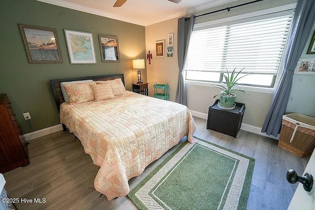 bedroom with ceiling fan, hardwood / wood-style floors, and ornamental molding