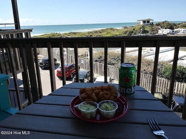 balcony featuring a water view