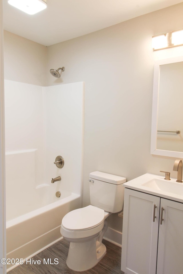 full bathroom with shower / bathing tub combination, vanity, toilet, and wood-type flooring