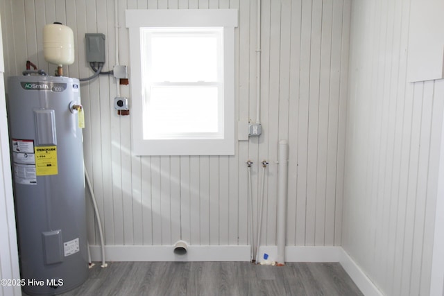 utility room featuring electric water heater