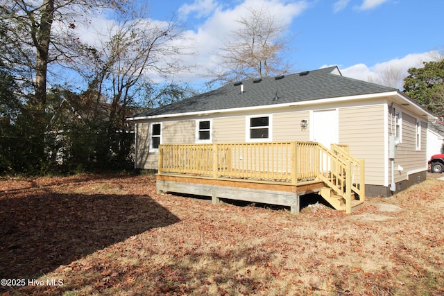 back of house featuring a wooden deck