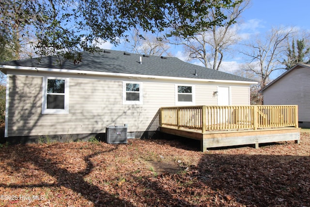 back of property featuring central AC unit and a wooden deck