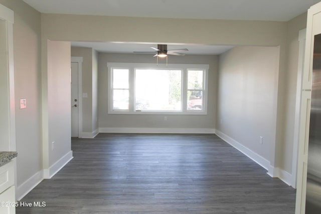 empty room featuring ceiling fan and dark hardwood / wood-style floors