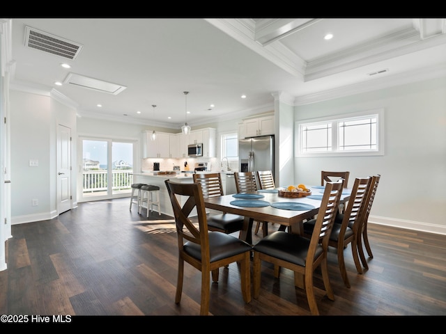 2083 New River Inlet Rd Unit A, North Topsail Beach, NC 28460 - dining room with dark wood-type flooring, baseboards, ornamental molding, and recessed lighting