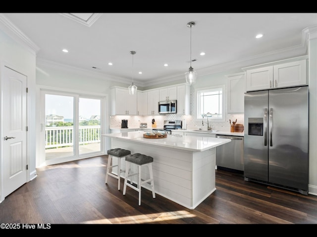 2083 New River Inlet Rd Unit A, North Topsail Beach, NC 28460 - kitchen with appliances with stainless steel finishes, a sink, a center island, dark wood-style flooring, and decorative backsplash