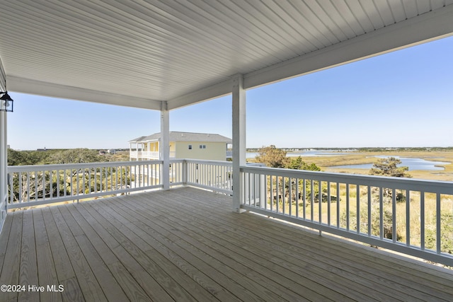 deck featuring a water view