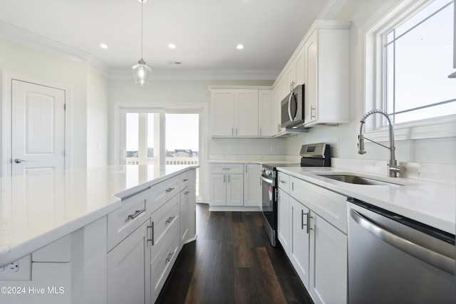 kitchen featuring sink, white cabinetry, and stainless steel appliances