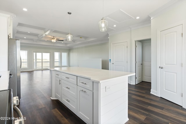 kitchen featuring beamed ceiling, ceiling fan, white cabinetry, and coffered ceiling