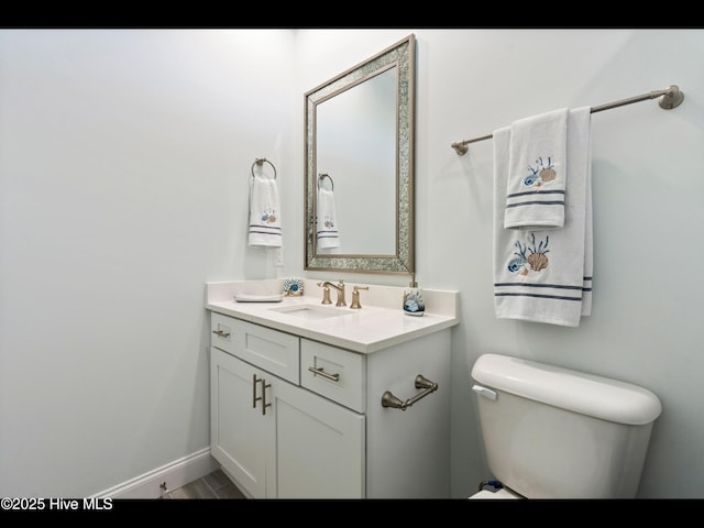 2083 New River Inlet Rd Unit A, North Topsail Beach, NC 28460 - half bath featuring vanity, toilet, and baseboards
